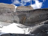 20 Looking Straight Up At Mount Kailash South Face, Atma Linga, And 13 Golden Chortens On Mount Kailash Inner Kora Nandi Parikrama The Mount Kailash South Face towers overhead as we near the face. The Atma Linga takes shape at the bottom of the face, and the 13 Golden Chortens are visible on the lower part of the face on the right (10:42)